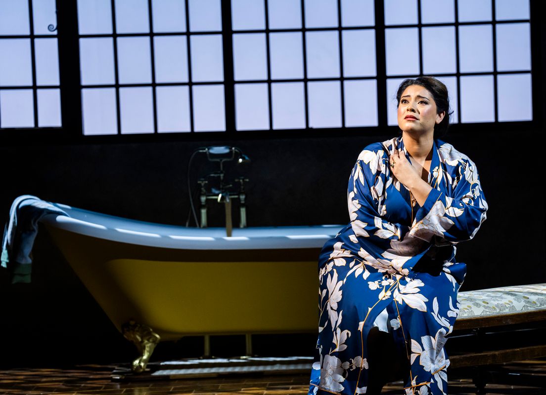 Person sat beside a bath