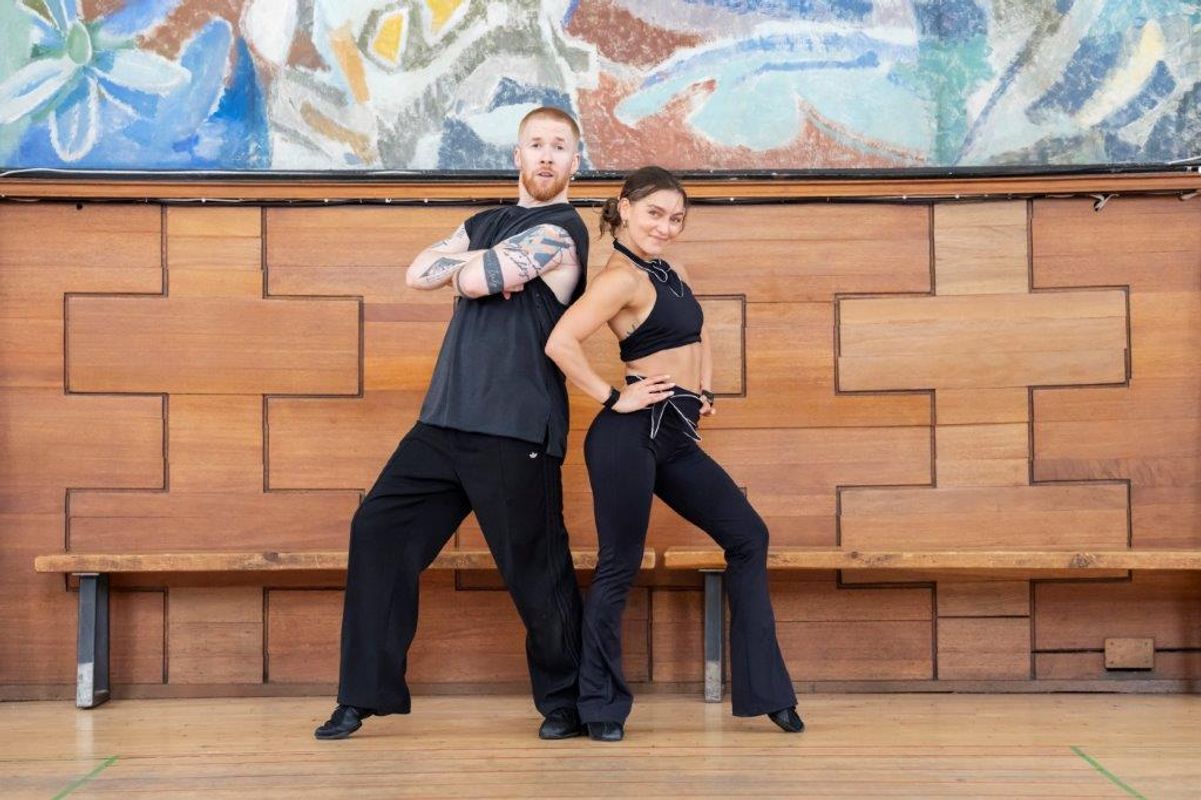 A group of dancers rehearsing in a dancing studio