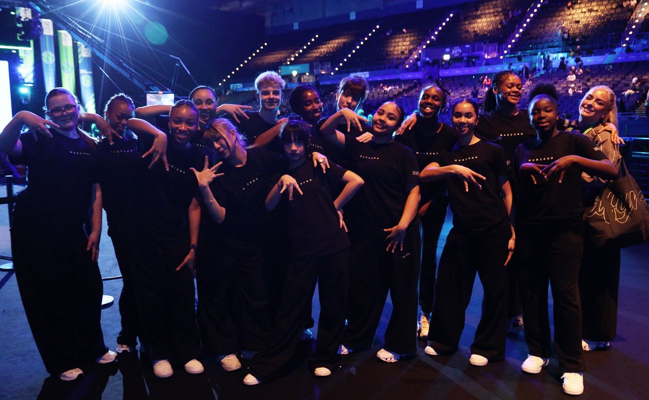 Group shot of Marshdon Dance Company posing on stage