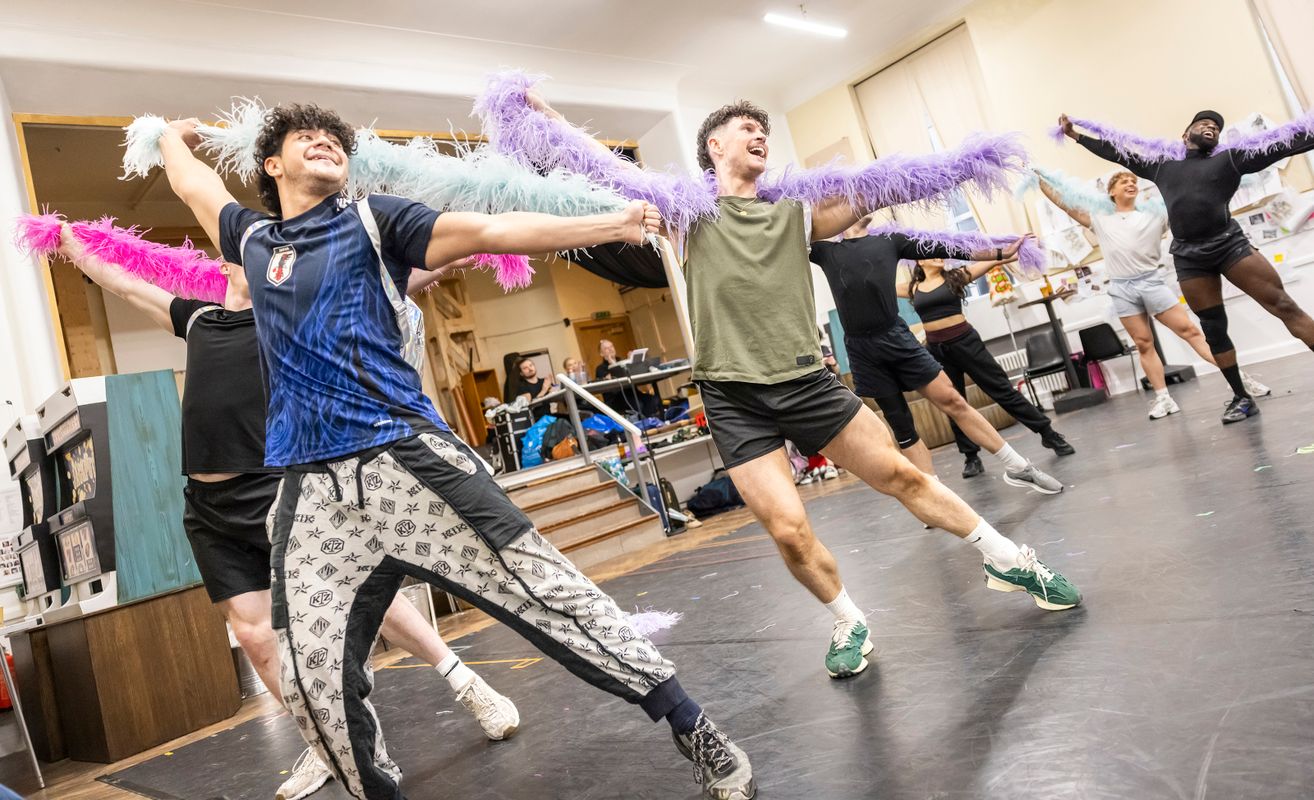 People dancing and rehearsing in a studio space