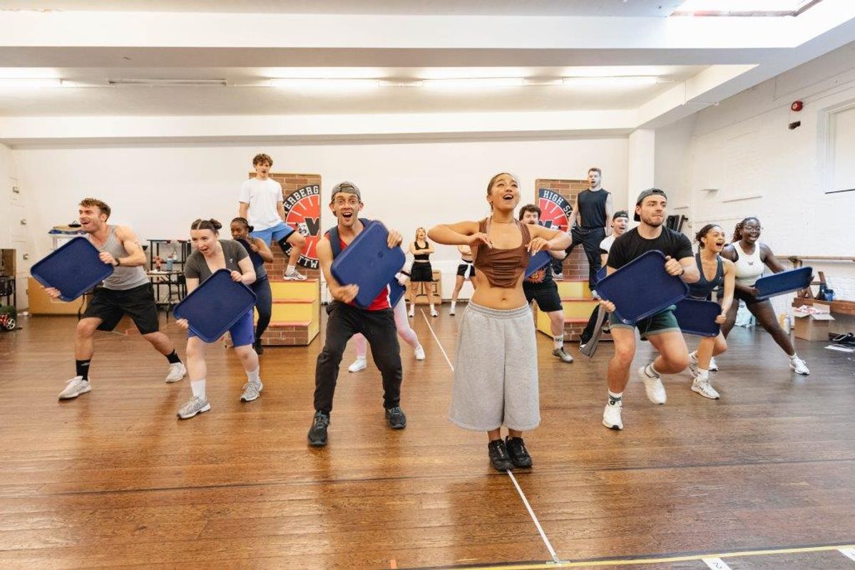 People in active wear rehearsing in rehearsal studio