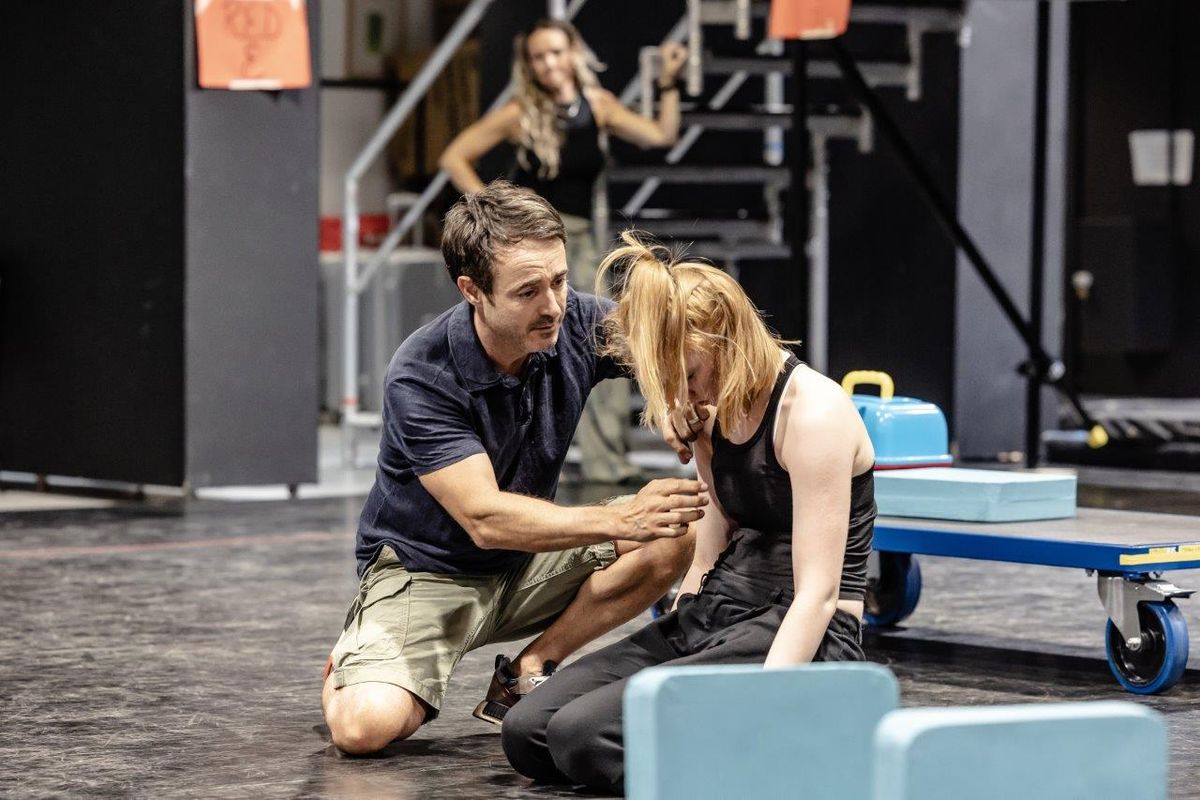 Performers rehearsing in studio space for The Curious Incident