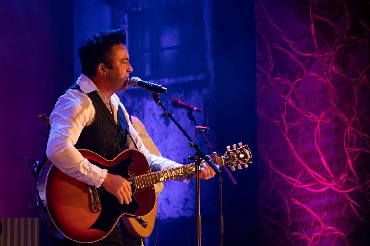 Johnny Cash Roadshow performing on stage.
