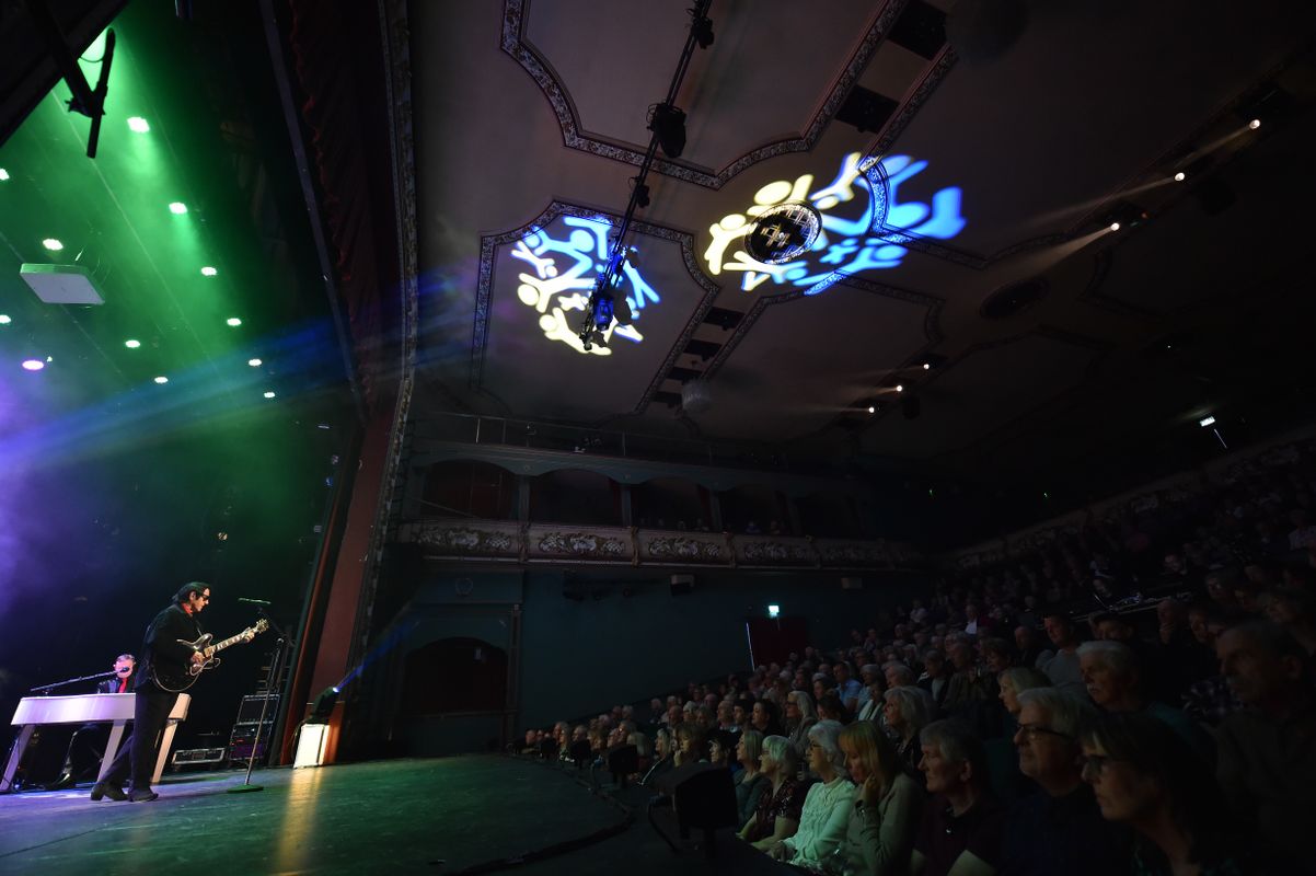 An audience watch the show.