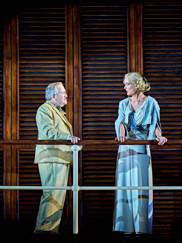 Two people have a discussion on stage.