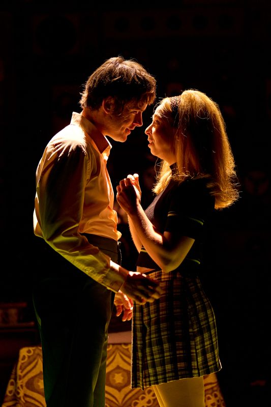 Two people look longingly into each others eyes.