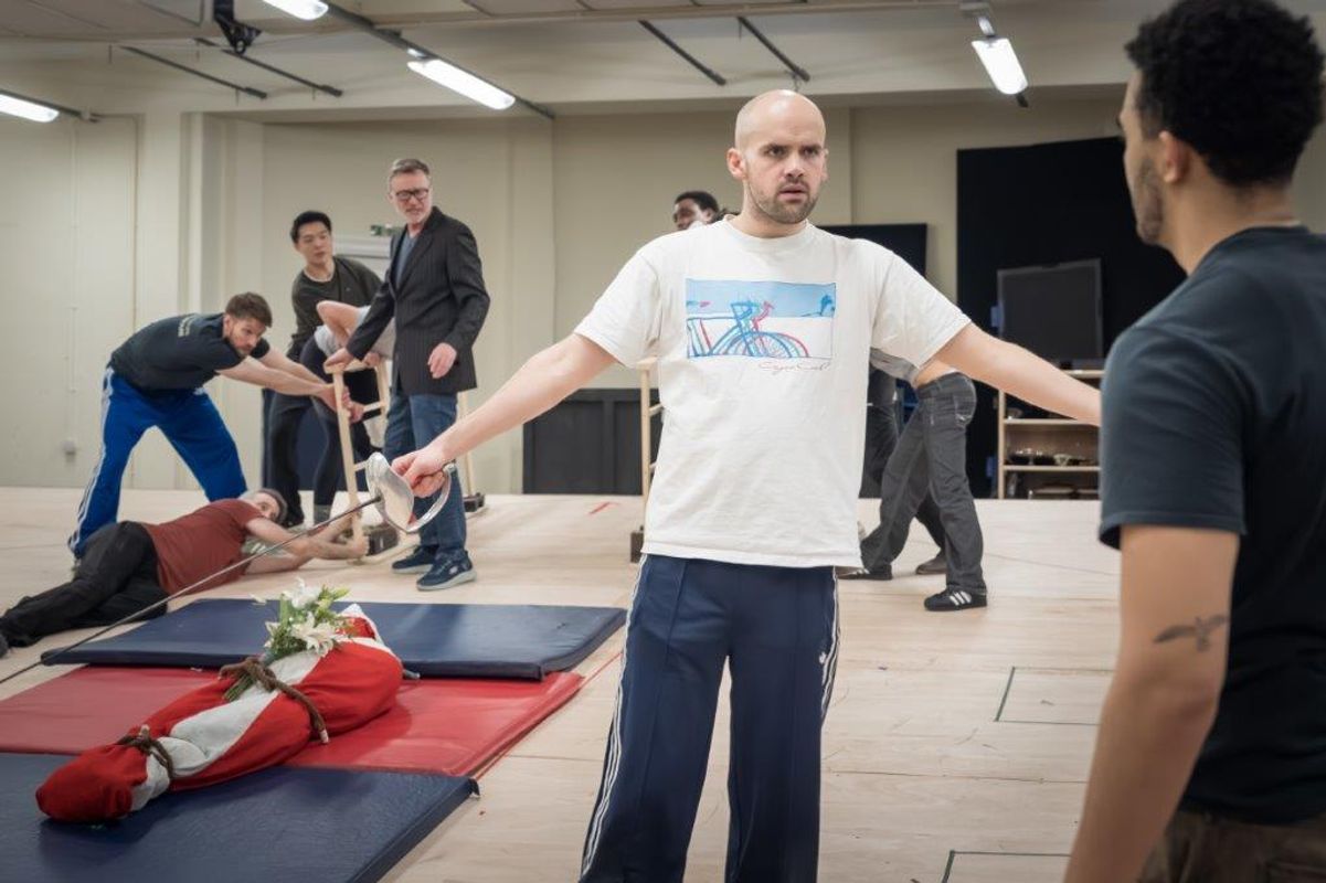 Group of people in rehearsal for Hamlet