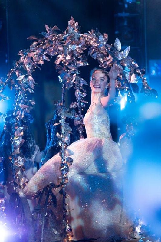 The Milwaukee Company dancing on stage for the production of Northern Ballet Cinderella. The are wearing Victorian styles costumes and are moving elegantly.