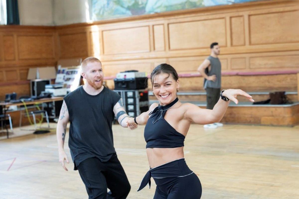 A group of dancers rehearsing in a dancing studio