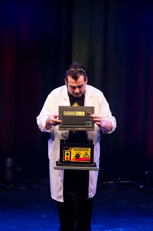 A person looks into a machine.