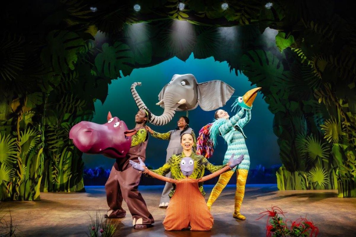 A hippo, elephant, monkey and bird stand centre stage,