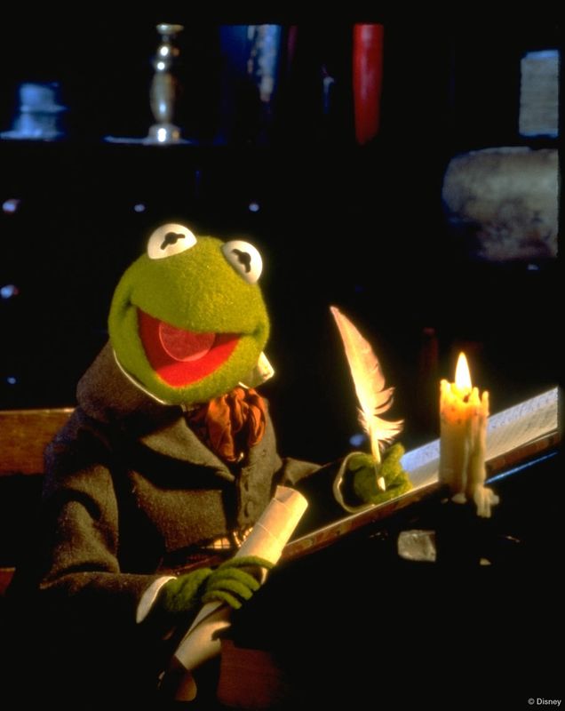 Puppet writing with a quill by candlelight