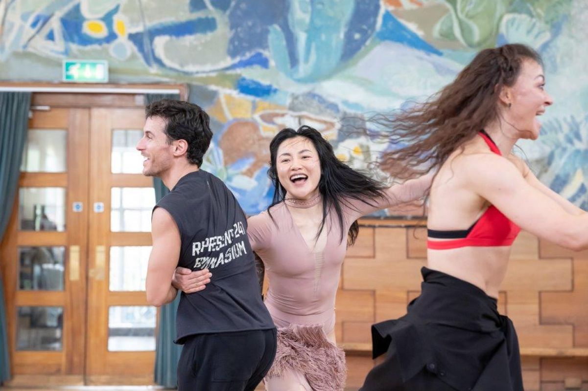A group of dancers rehearsing in a dancing studio