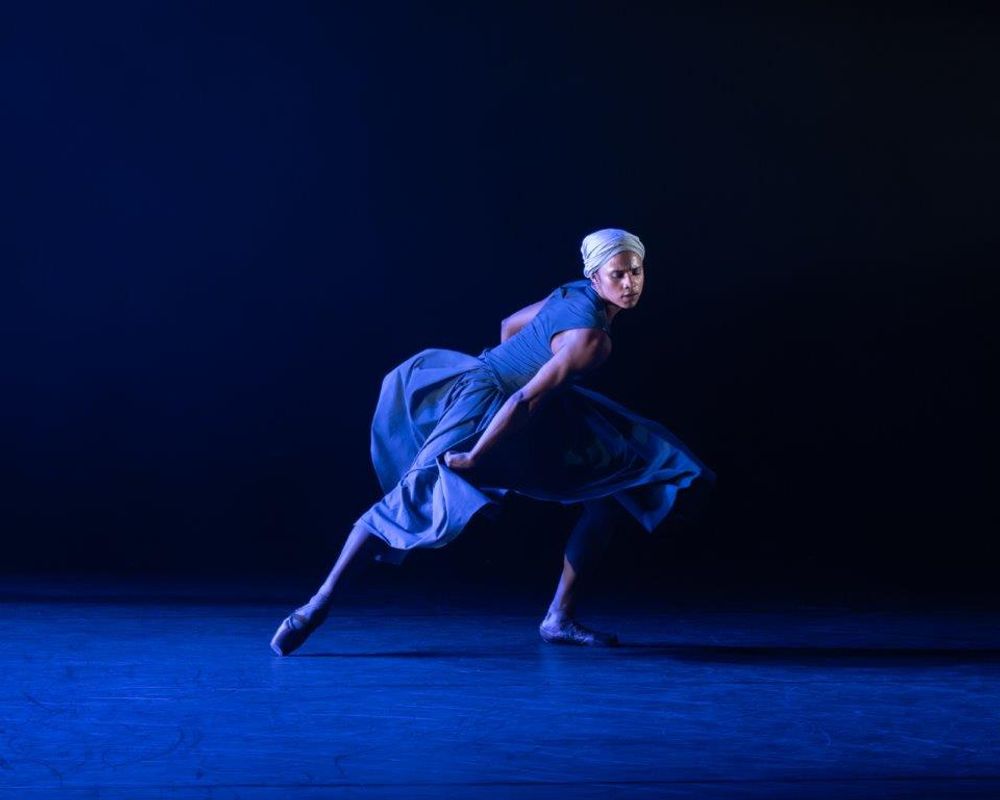 Dancer centre stage and their dress is flowing