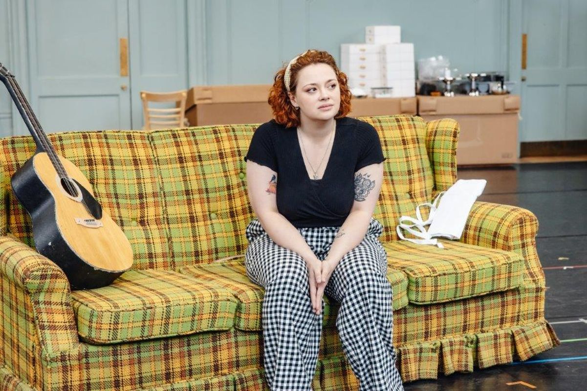 A person sat on a sofa 