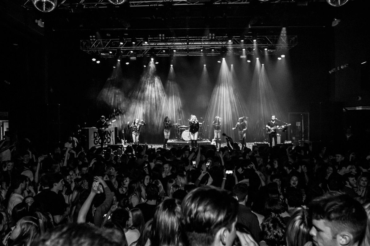 A black and white images shows a crowd watching the show.