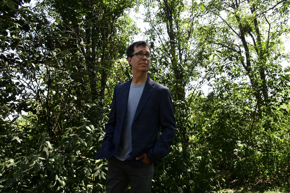 Ben Folds stood in front of trees