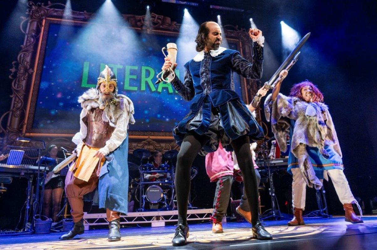 People on stage dancing around in tudor clothes