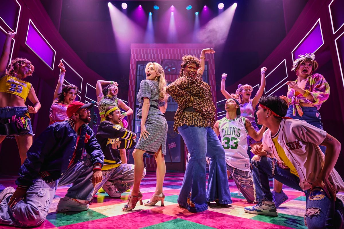 Legally Blonde cast on stage posing.