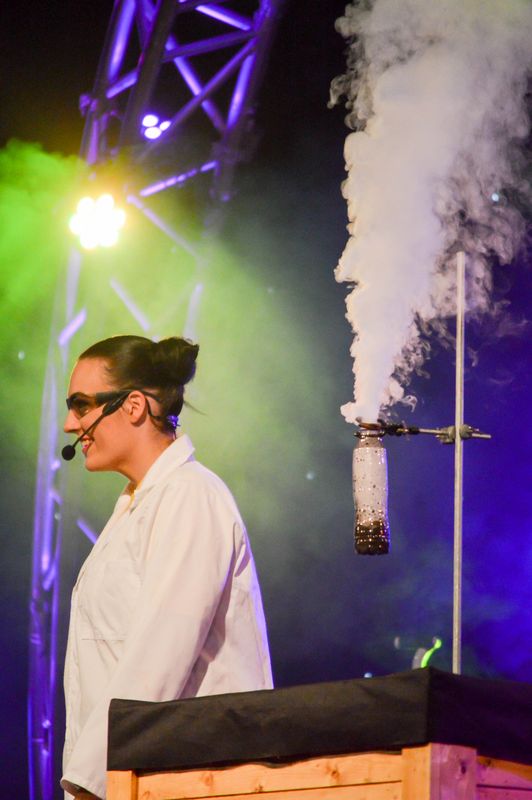 Dry ice appears from a bottle.