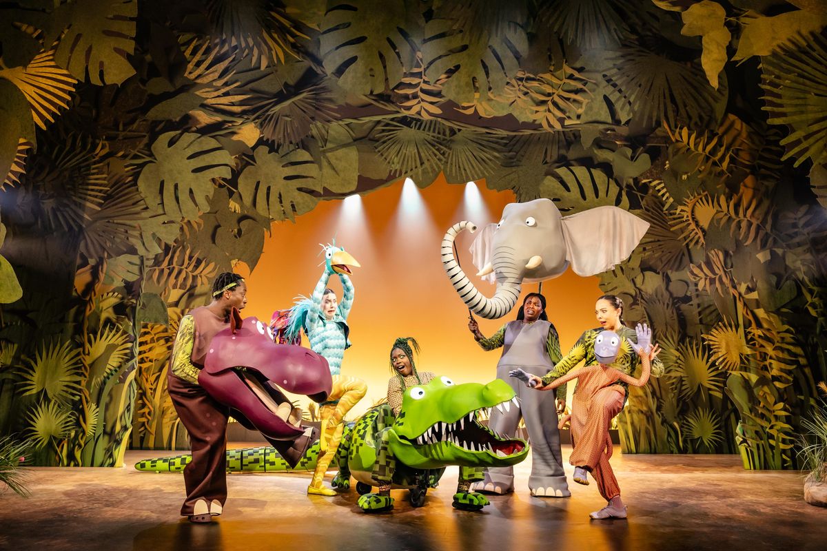 There are five characters on stage, one is a hippo, another is a bird, there is a crocodile, elephant and a monkey
