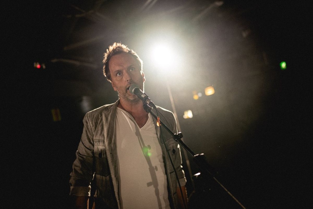 A man singing into a microphone.