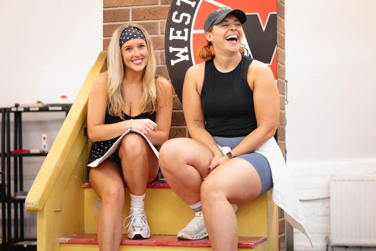 People in active wear rehearsing in rehearsal studio