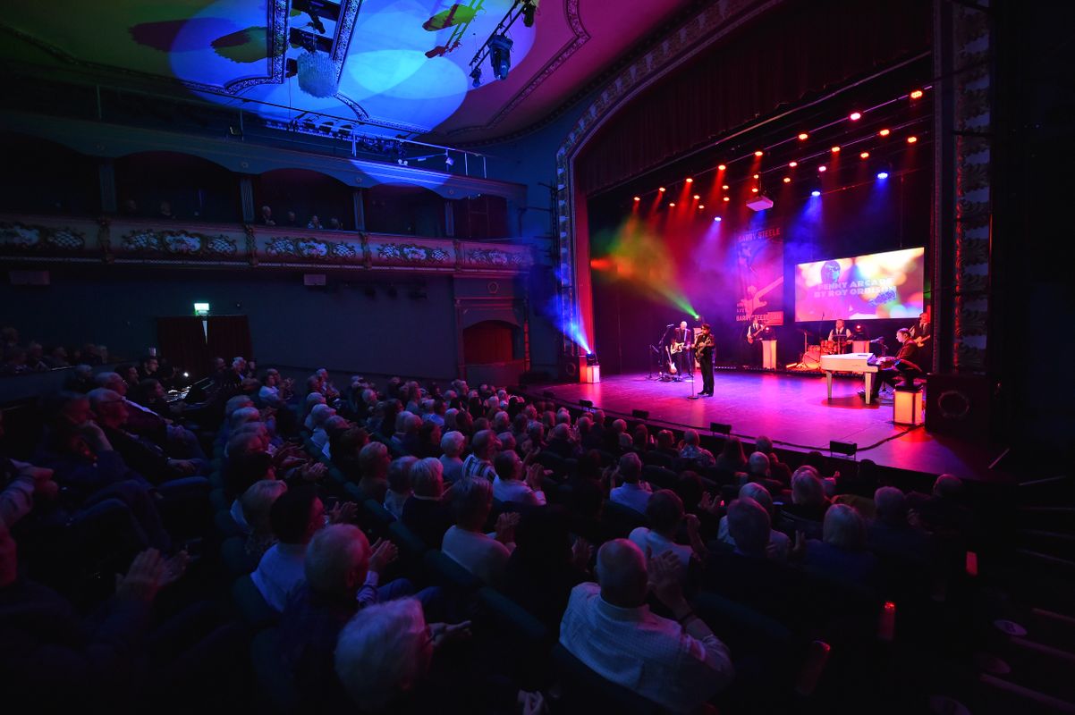 An audience watch the show.