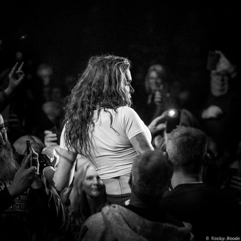 A person crowdsurfs.