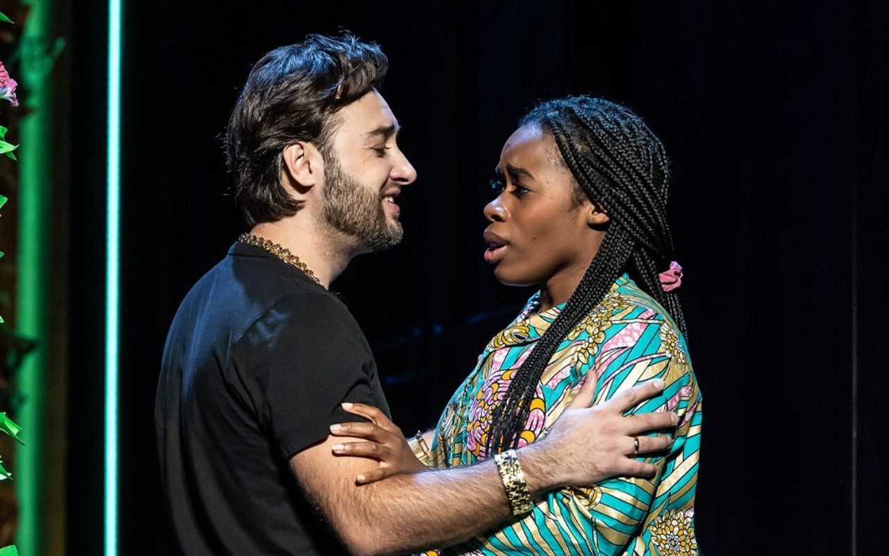 Two people have their hands on each others arms