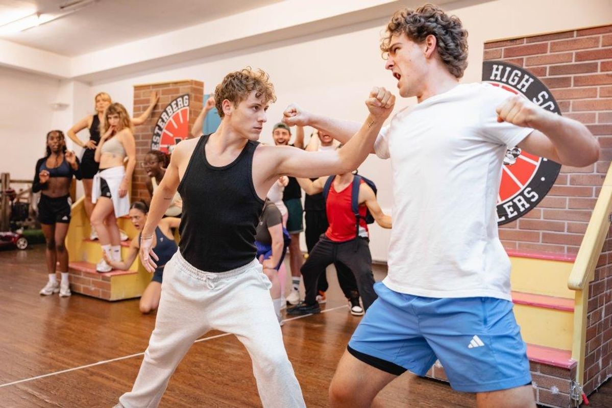 People in active wear rehearsing in rehearsal studio