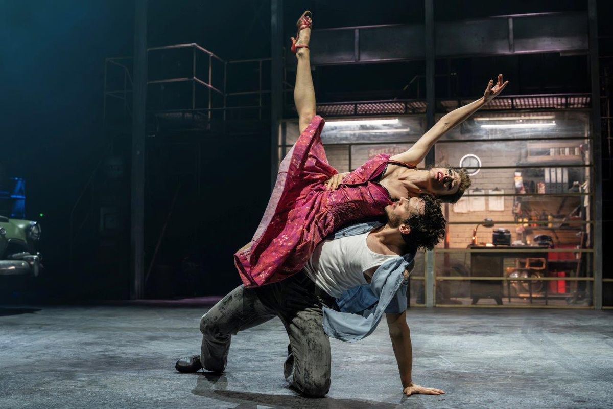 A man and a woman are dancing with each other