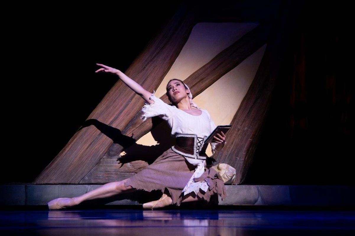 The Milwaukee Company dancing on stage for the production of Northern Ballet Cinderella. The are wearing Victorian styles costumes and are moving elegantly.