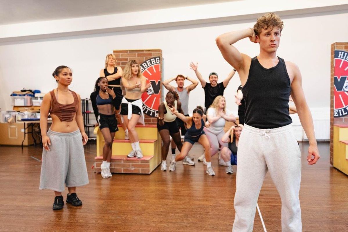 People in active wear rehearsing in rehearsal studio